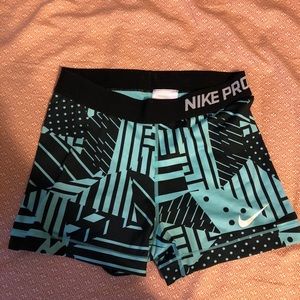 Black and blue nike pros